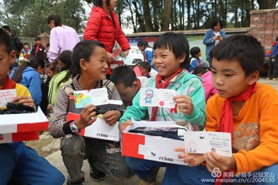Children receiving shoes